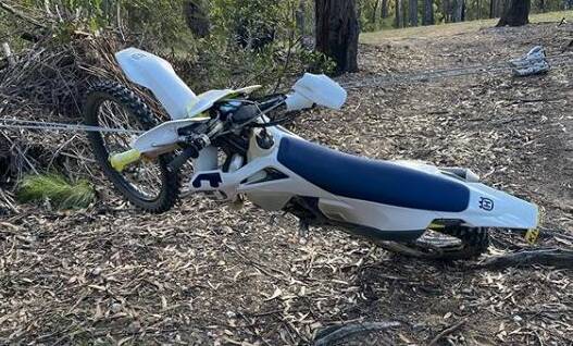 Images posted to Instagram show the dirtbike tangled in wire cables stretched across a track on private property near Quarantine Bay Estate, Eden