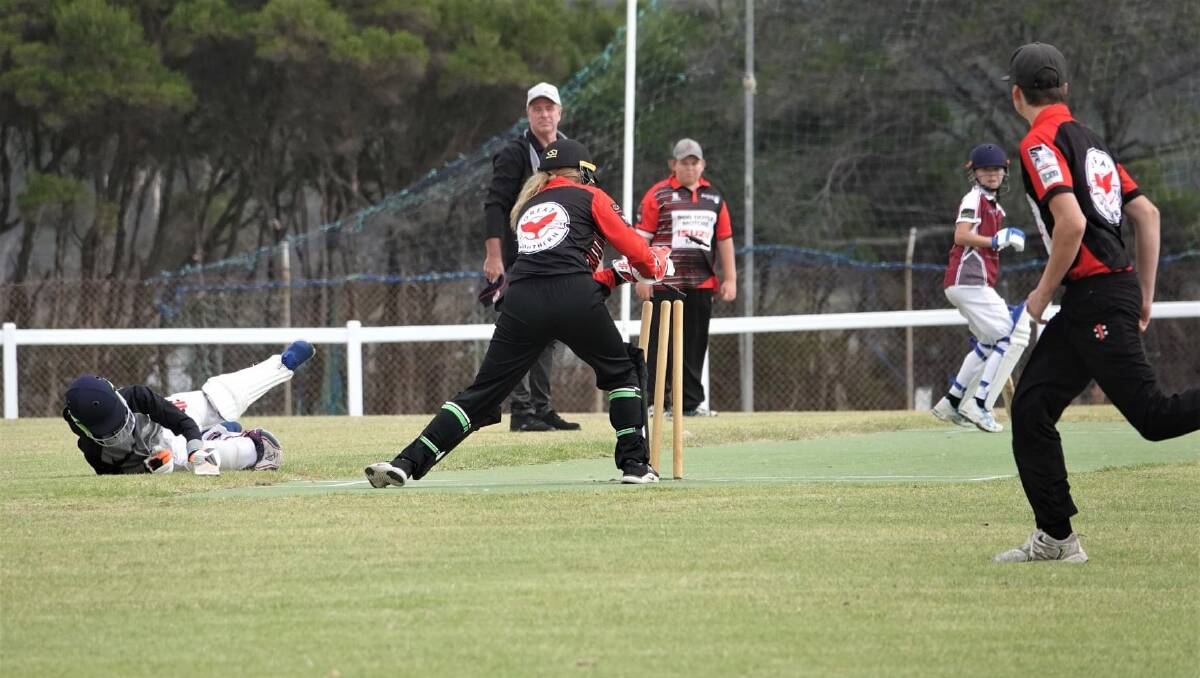 QUICK HANDS: Eden under 15s wicketkeeper Jemma Pollock effects a Tathra run out after receiving a throw from Jack Caldwell in last weekend's semi-final. Photo: Mick Fulton