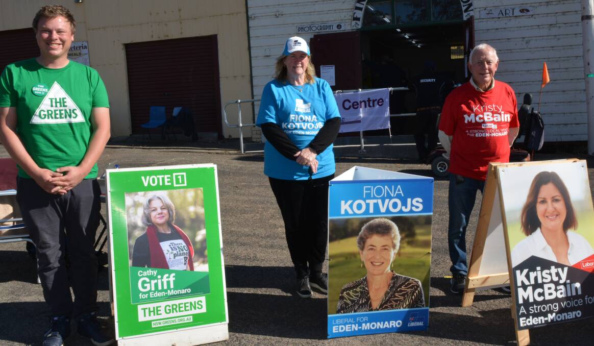 Jerry Langford, Carol Carmody and Rick Fletcher man the candidate info tables at Bega's pre-polling centre on Monday morning. Photo: Ben Smyth