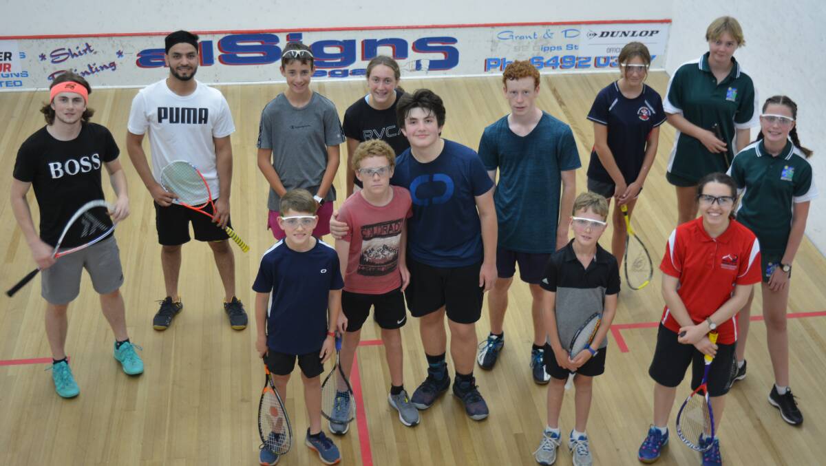 Tate Zak Norris and Mansoor Zaman take a group of juniors through their paces on Friday night. Photo: Ben Smyth