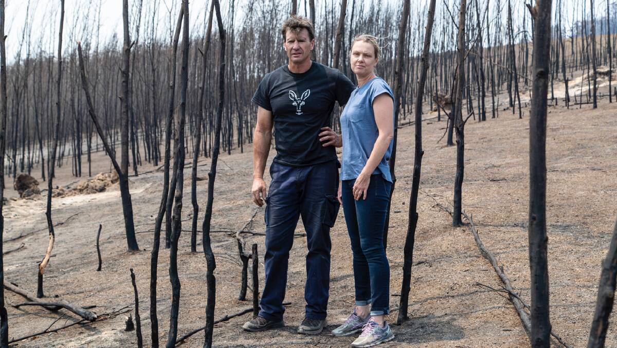 Gary Henderson and Sara Tilling on what remained of their wildlife sanctuary at Cobargo following the bushfires earlier this year.