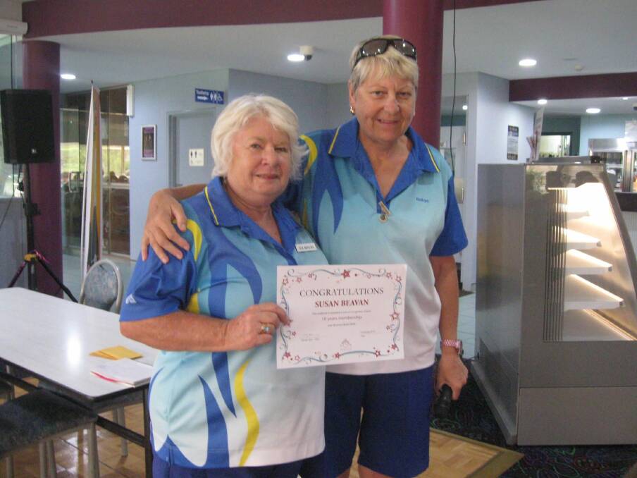 MALUA BAY: Sue Beavan receives her certificate and badge from Robyn Butcher.