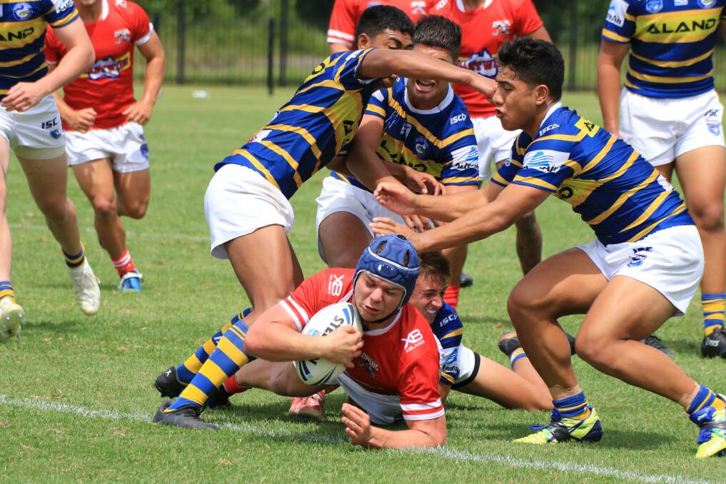 Warilla-Lake South’s Blake Dowel scores a try for the Steelers. Photo: ALLAN BARRY