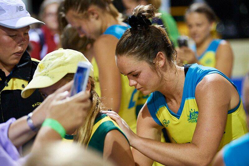 Hockeyroos' Kalindi Commerford signs  a young fans jersey. Photo: SUPPLIED