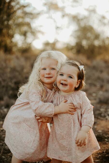 SMILING FOR MUM: Lola Kennedy and Fiorence Kennedy wearing their mum's designs for Kennedy the Label, as featured in Buy for the Bush last week. Photo: GEORGIE NEWTON PHOTOGRAPHY. 