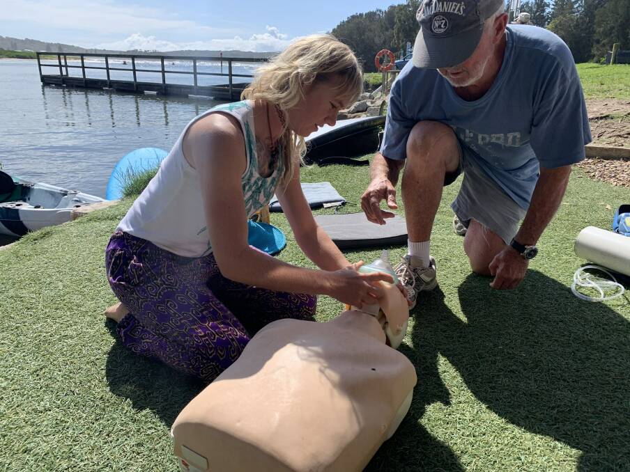 Lifesavers set up defibrillator at Mossy Point Boat Ramp Kiosk