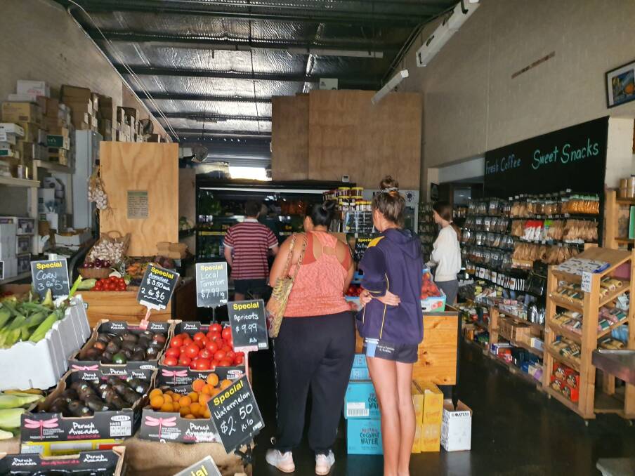 Shoppers visit Southlands Fruit and Veg for basic supplies during the bushfires and no power. 