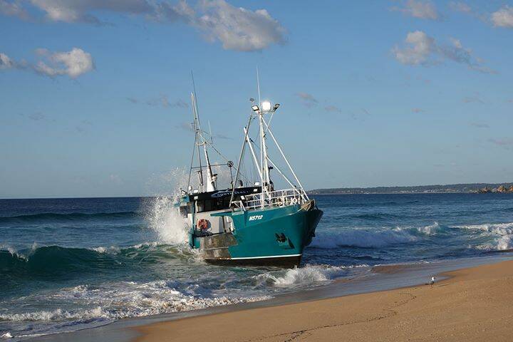A longliner vessel stuck on the beach between the Wallaga Lake entrance and the Tilba Cemetery. Picture: Alison Kuiter.
