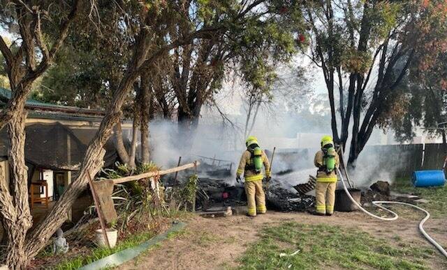 Firefighters quickly control the blaze that burned a caravan to the ground at Moruya on Monday, September 27. Image: Moruya Fire and Rescue. 