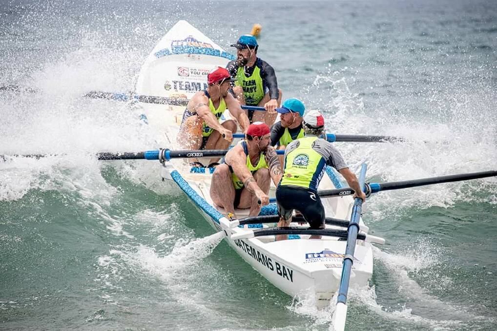 The Batemans Bay Open Men's crew punch through a wave at the national team selection event on Sunday. Image: Malcolm Trees.