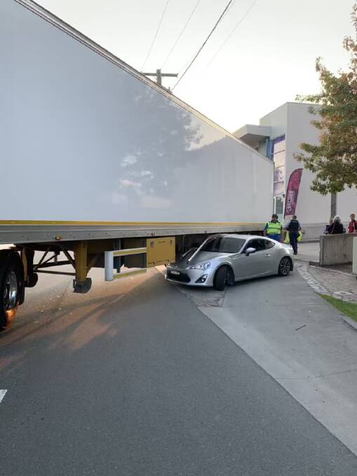 A semi-trailer's underride bars stop a vehicle at the exit ramp of Batemans Bay Village Centre. 