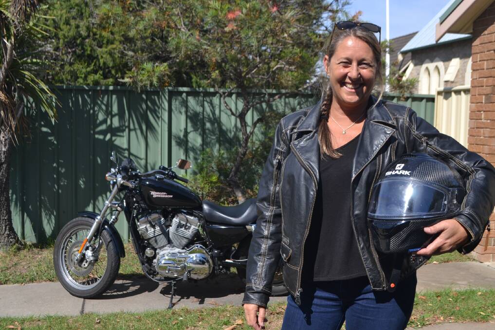 HAPPY WOMEN'S DAY: Mother and motorbike lover Cathy Ferguson celebrates International Women's Day by riding her Harley to work. 