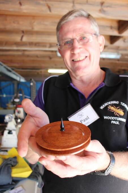 Woodwork: Bega District Woodcraft Association member Paul Healy with a silky oak bowl he made from the old Bega Post Office counter top.
