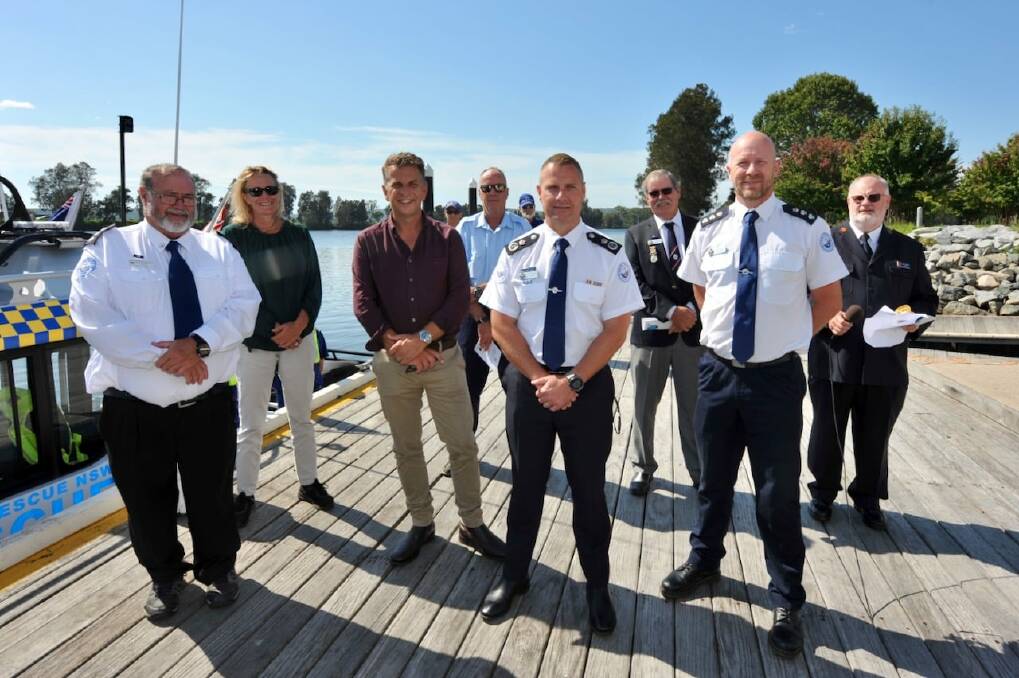 Welcome: Shire mayor Liz Innes, Bega MP Andrew Constance with Marine Rescue NSW personnel at Moruya Wharf.