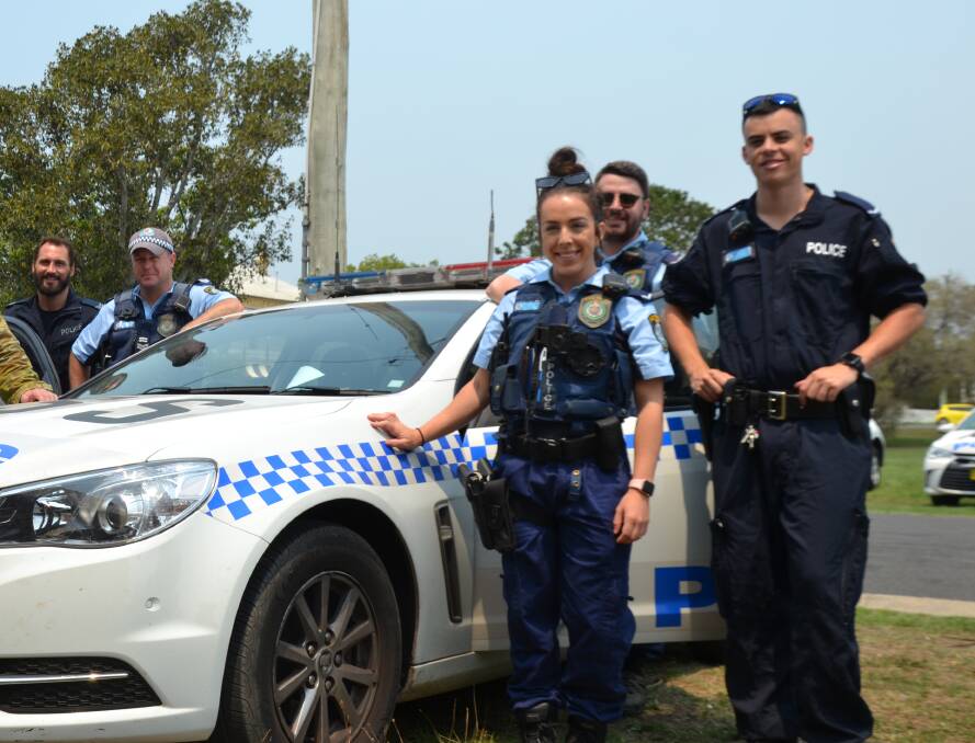 Police officers from Sydney at the Moruya Emergency Operations Control Centre, ready to door-knock residents. 