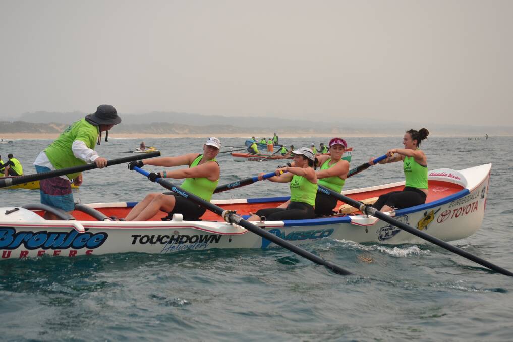 ROW HARD: Broulee Wombats Open Women's crew row to the finish of the second leg at Coila before the summer George Bass Marathon was cancelled.