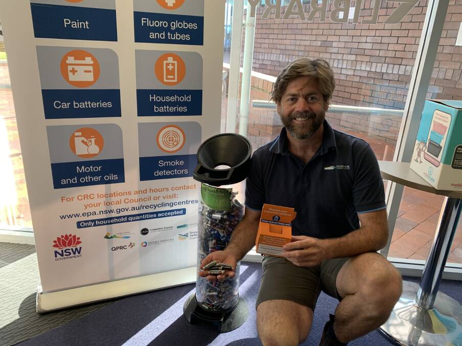 Councils waste minimisation officer Adam Patyus at one of Councils battery recycling collection points, where residents can pick up a box free of charge to store batteries until theyre ready to be dropped off.