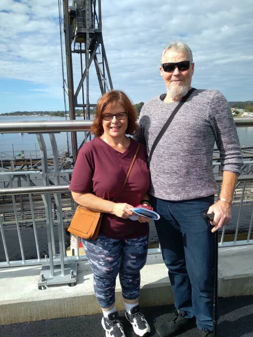 Julie and Peter Downs of Malua Bay pictured walking over the new bridge.
