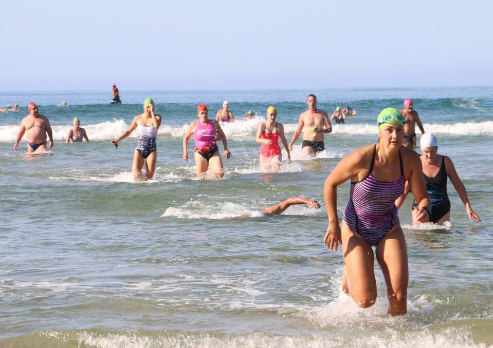 Breakers swim: Swimmers wade for the finish line at last year's Broulee Bay to Breakers Ocean Swim. Picture: Supplied.