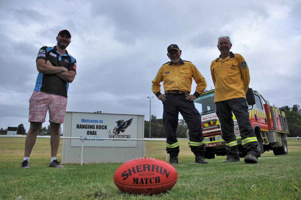 Late gift: Batemans Bay seniors coach Michael Kenny met up with Malua Bay RFS to present the donation which would be put towards firefighting equipment. 