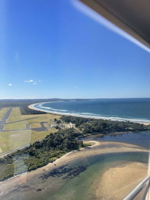From inside an aircraft, the Moruya Airport is pictured in the distance. 