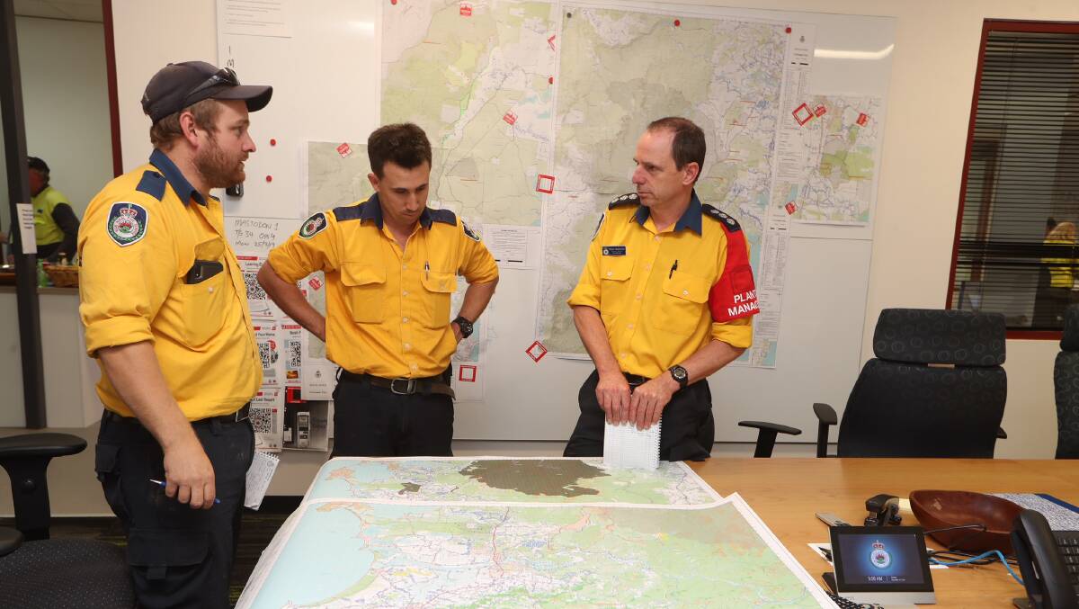 NSW Rural Fire Service crews at the Shoalhaven Emergency Management Centre on Monday. Picture: Sylvia Liber