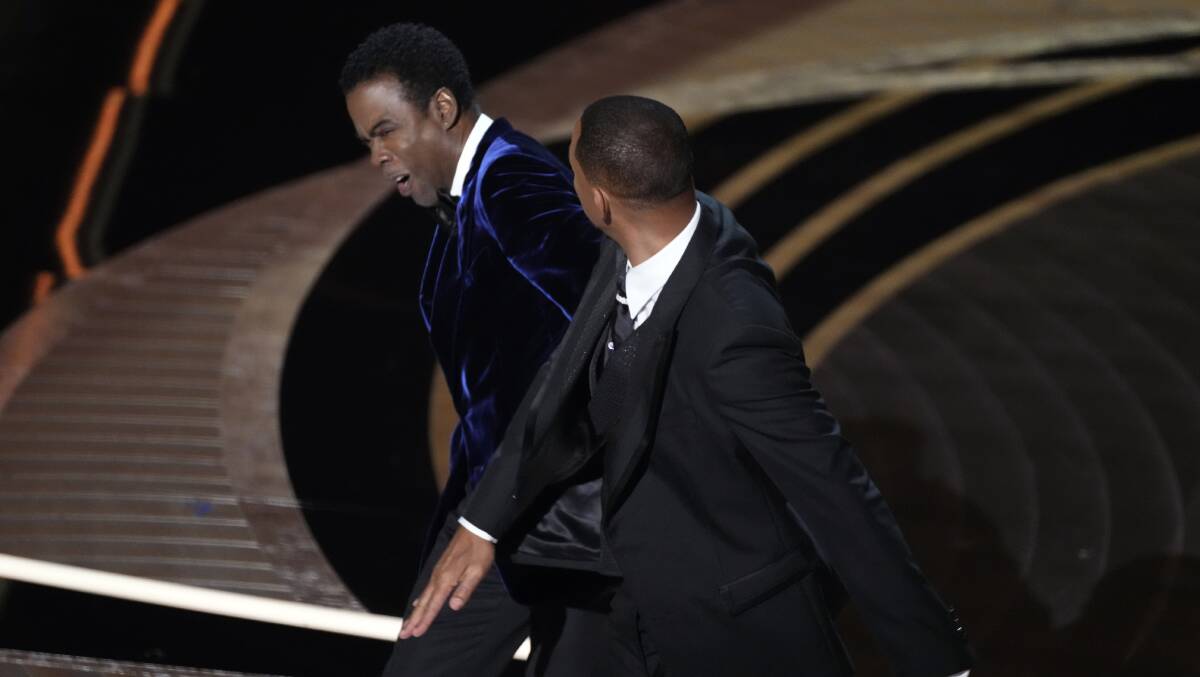 Will Smith confronts Chris Rock as he presents the award for best documentary feature. Picture: Image
