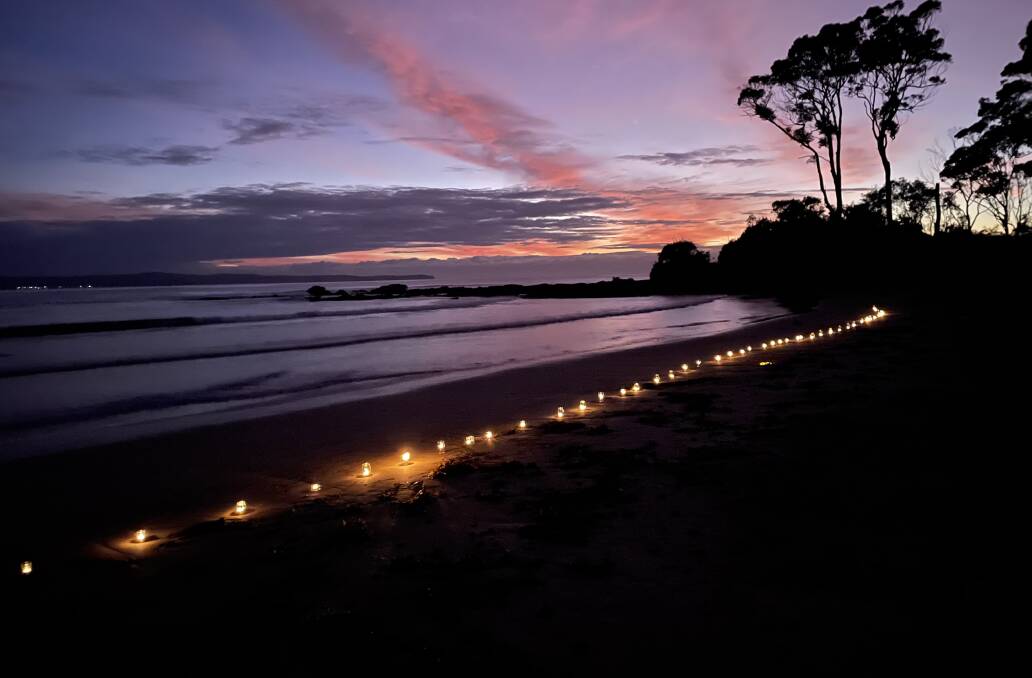 Pic of the week: Candles light up Wimbie Beach on Anzac Day 2022. Photo by Dawn Simpson