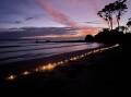 Pic of the week: Candles light up Wimbie Beach on Anzac Day 2022. Photo by Dawn Simpson
