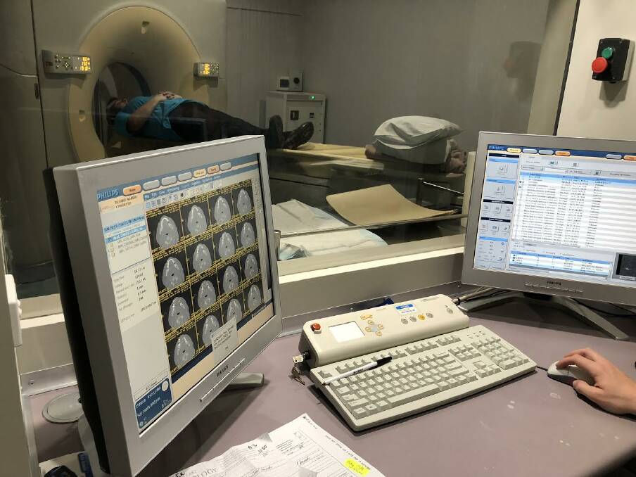 INITIAL EXAM: The first ever patient to have a CT scan in Batemans Bay undergoes the procedure at the new South East Radiology practice.