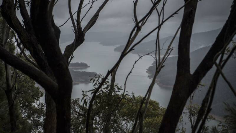 Much needed rain showers last month fael into Lake Burragorang in Nattai. Lake Burragorang forms part of the Warragamba Dam. Photo: Wolter Peeters