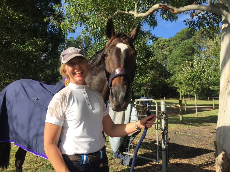Sharon Cooper and Reg at the stables in Berry. They have competed in eventing, show jumping and dressage for 10 years, and look forward to their first Sydney show on April 19. Picture: Rebecca Fist