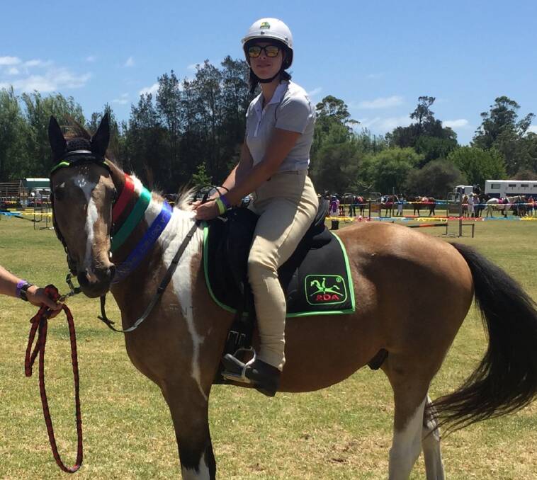 TEAM SPIRIT: Caitlin Blay on Ace at the Moruya Show last year. Caitlin will ride another horse, Millie, at the 2018 Royal Easter Show with a team of eight Eurobodalla riders. 