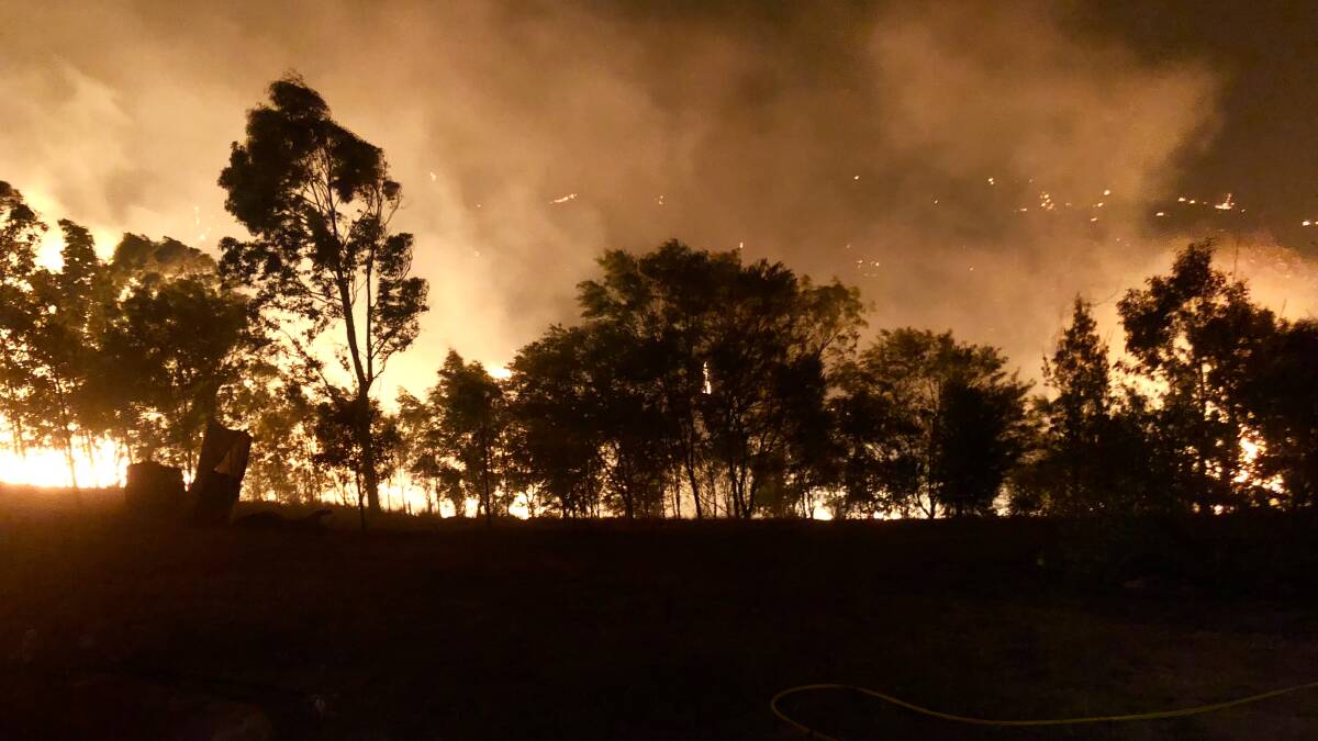 More than 110 Eurobodalla personnel have assisted at the Yankees Gap fire, near Bemboka, which has destroyed over 7500 hectares and three homes. Photo NSWFR Narooma.