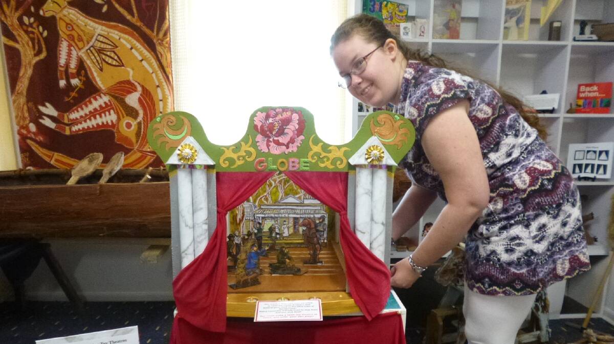 BITE-SIZED BRIGANDS: Zoe Brassil demonstrates the Old Courthouse Museum's new miniature theatre - its characters and scenery are inspired by the Clarke gang. 