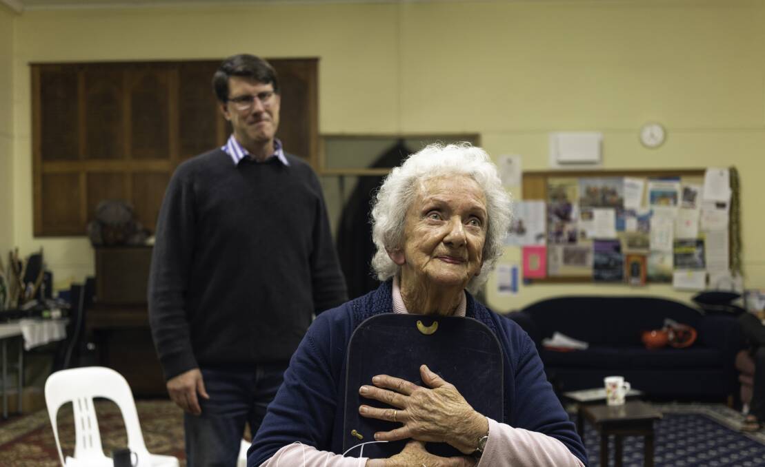 LIFELONG LOVE: Moruya's Mary Kell, 92, rehearses for her special role in Red Door Theatre's latest production, 'All in a Night's Work', as theatre president Anthony Mayne watches on. Photo: Jake Traynor.