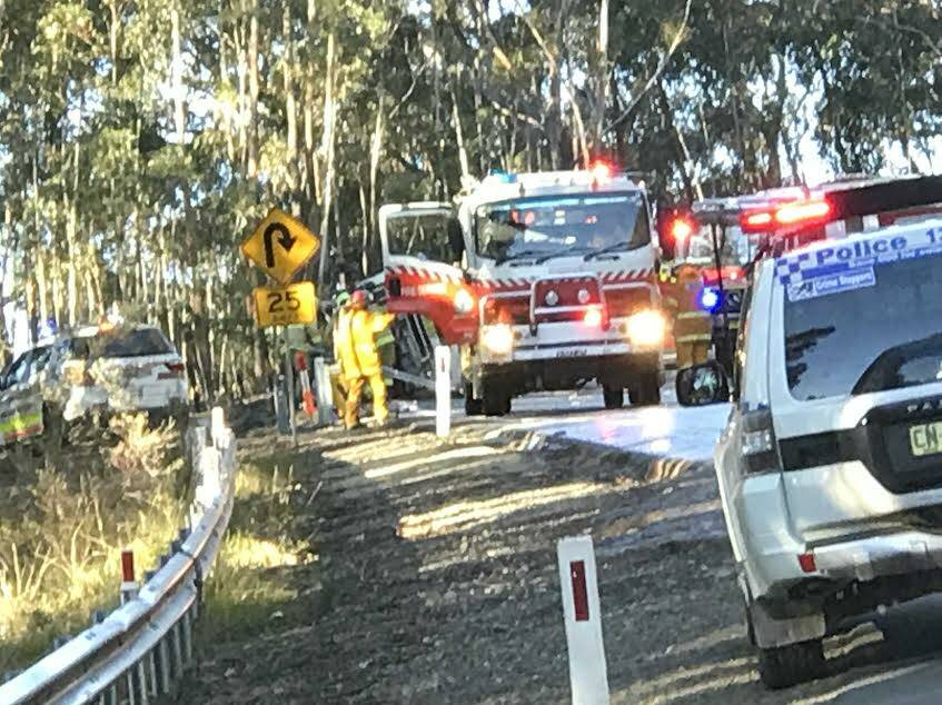 TRUCK CRASH: Emergency crews are at the scene of a truck rollover on the Kings Hwy, on the Clyde Mountain, on Saturday morning. Photo: Amy and James Collins.