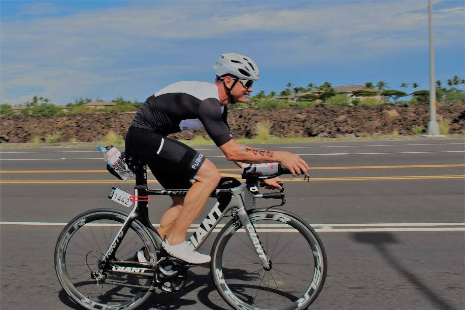 Mossy Point's Daniel Beby pushes on during the 180km big leg in the gruelling Ironman World Championship in Kona, Hawaii. 