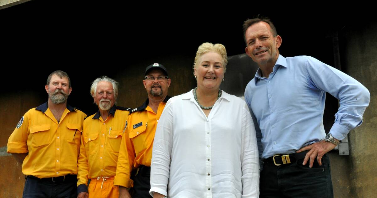 Eurobodalla RFS members Damian Oborn, John Parker and Ian Aitken with Gilmore MP Ann Sudmalis and former PM Tony Abbott. PICTURE: Kate Lockley.
