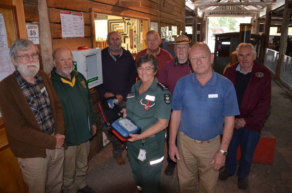 ON THE PULSE: Eurobodalla Woodies and Moruya Antique Tractor and Machinery Assocation members Eric Simes, Helmut Delrieux, Kim Taylor, Dave Hartwig, Barry Hickson and Ernie Douglas (back row) with first aid officers Susanne Page and Michael Barkley (front).