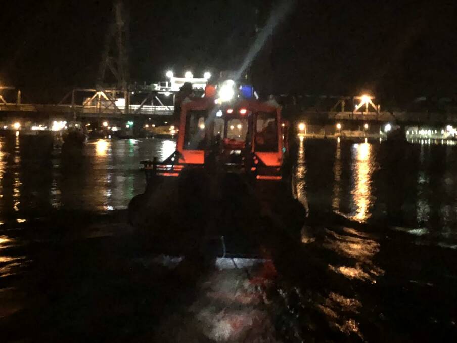 TOWED TO SAFETY: Batemans Bay Marine Rescue crew members were called to assist a vessel experiencing mechanical problems on the Clyde River over the weekend. Photo: NSW Marine Rescue.