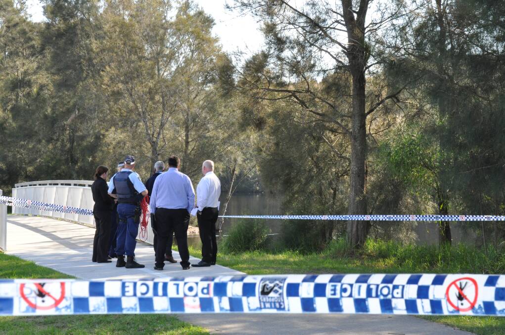 CRIME SCENE: Officers at a crime scene in Batehaven on Tuesday morning where the body of a man was retrieved from the water.