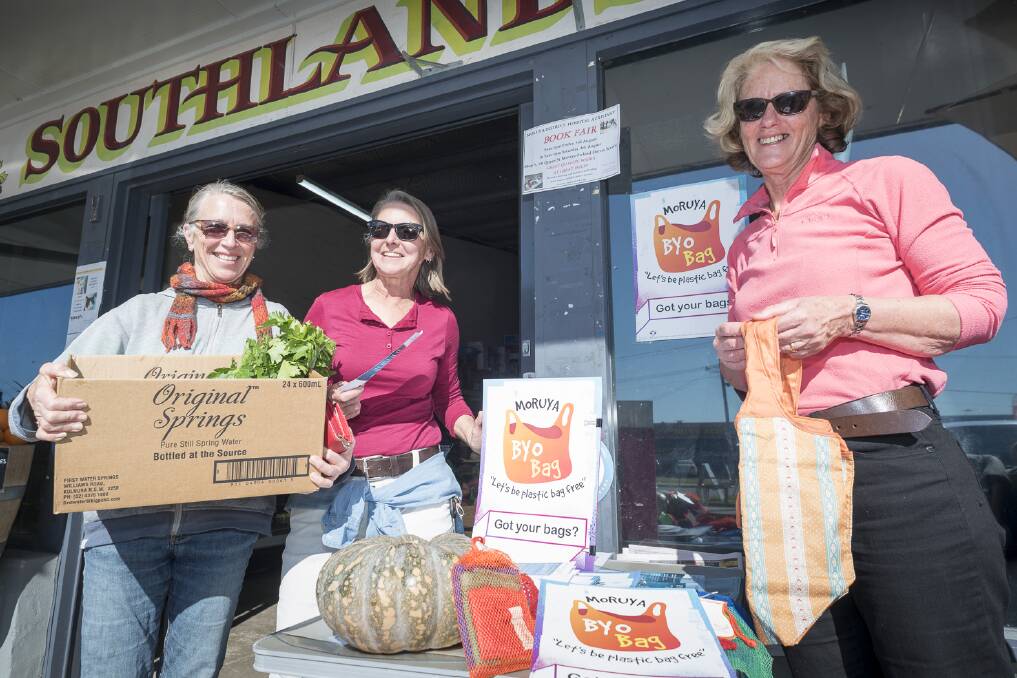 BAGGING PLASTIC: Volunteers host an information stall outside Southlands Moruya, encouraging shoppers to ditch single-use plastic bags.
