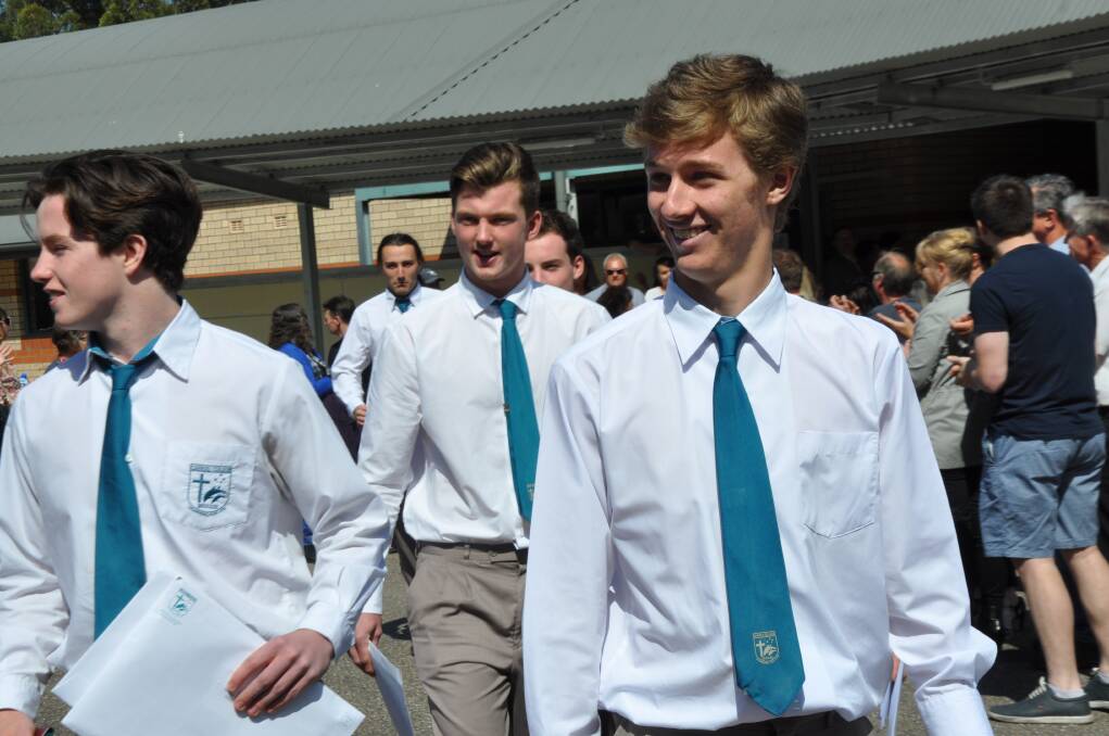FOND FAREWELL: Carroll College Year 12 students pass through a guard of honour after their graduation on Wednesday.