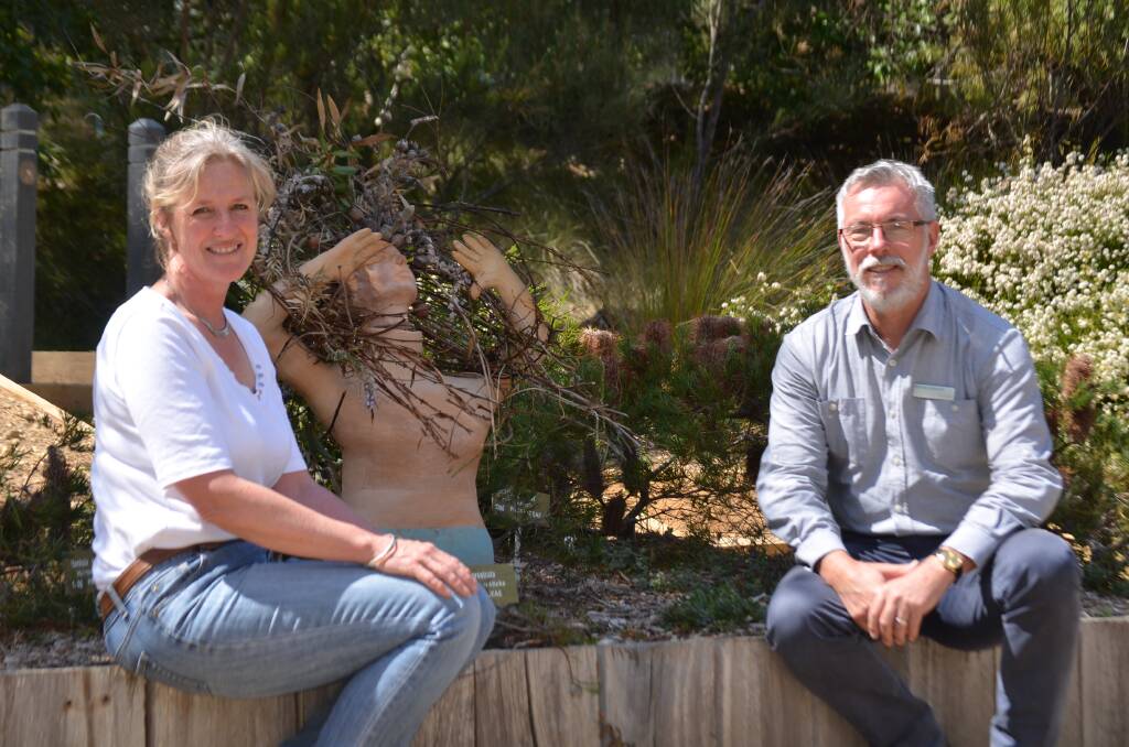 EYE-CATCHING: 'Up the Garden Path' curator Andrea Warren and Gardens manager Michael Anlezark with artist Susan Curran's sculpture 'Garden Venus'.