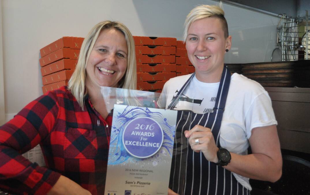 SLICE OF SUCCESS: Emma Corbett and Joanna Imrie proudly display their award from the Restaurant and Catering Industry Australia's awards night.