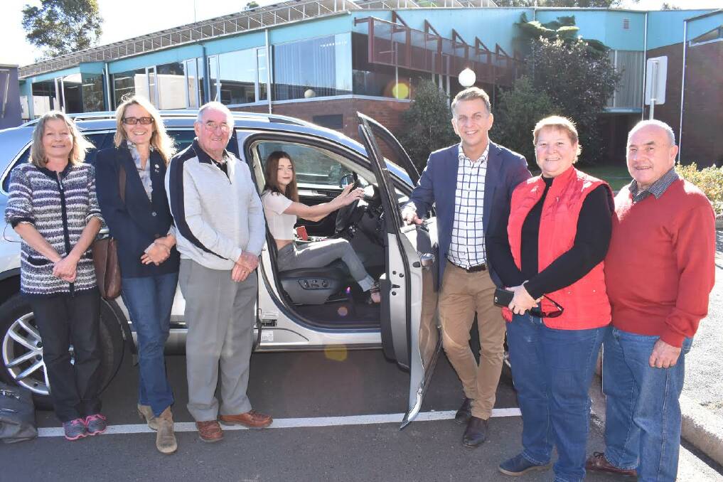 LICENCE TO DRIVE: Y Drive learner driver Jaimee Allen (behind the wheel) with her mum Virginia Allen, Eurobodalla Shire Mayor Liz Innes, Y Drive mentor Jeff Halls, Bega MP Andrew Constance, Y Drive coordinator Angie McMillan and councillor Phil Constable at the June 15 funding announcement in Moruya.