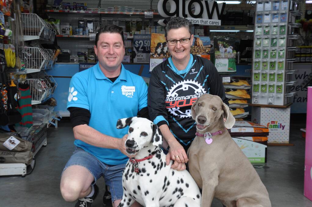 MICROCHIP BLITZ: Rayden Palmer, of Petstock Batemans Bay, and Vicki Moorhead have encouraged pet owners to get their beloved dog or cat microchipped this month in an effort to keep lost animals out of pounds. Pictured with pooches Lola and Forrest. 