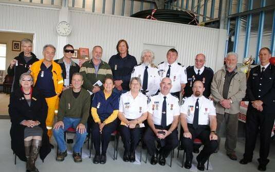 Richard Bate (back row, third right) with Central Tilba RFS members and Superintendent John Cullen (back row, far right) at the opening of the new station in 2012.