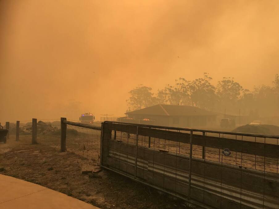 CLOSE TO HOME: Fire and Rescue NSW has reminded householders of what they can do to protect their home ahead of a dangerous fire season. Photo: FRNSW Inspector John Moore, taken at the Mount Kingiman fire on Wednesday.